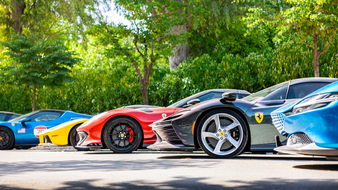 pexels-quentin-martinez-2147503099-32692341 Luxury Sports Cars Parked Under Green Trees